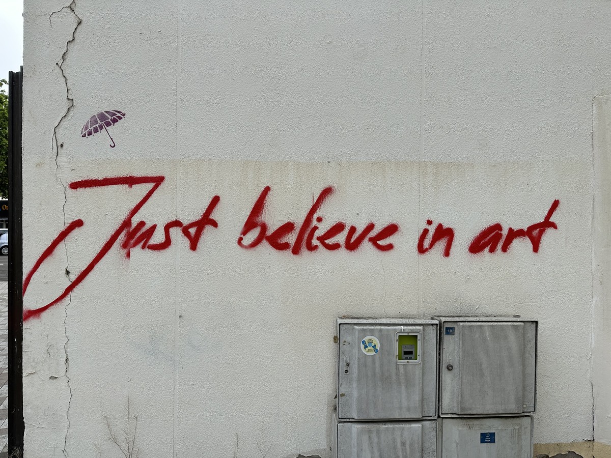 Colorful street art mural on a wall in the old town of Arles