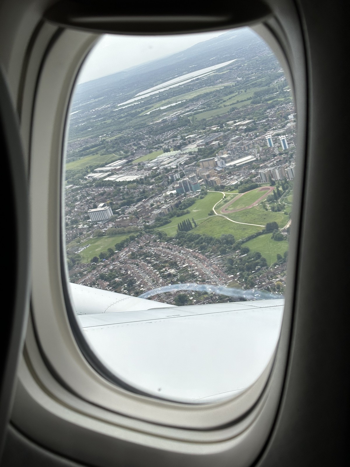 Aerial view of green English countryside through an airplane window