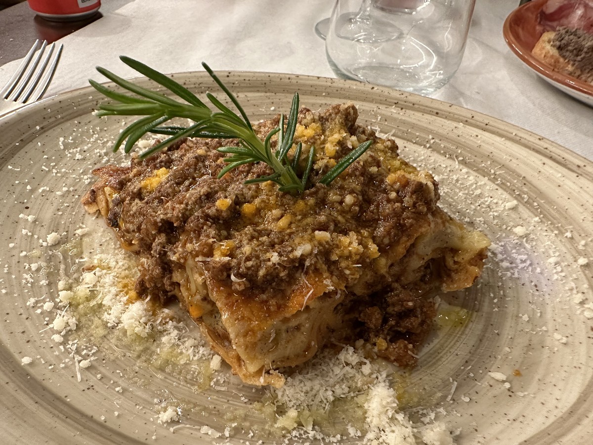 A plate of traditional Tuscan lasagna at a restaurant in Florence