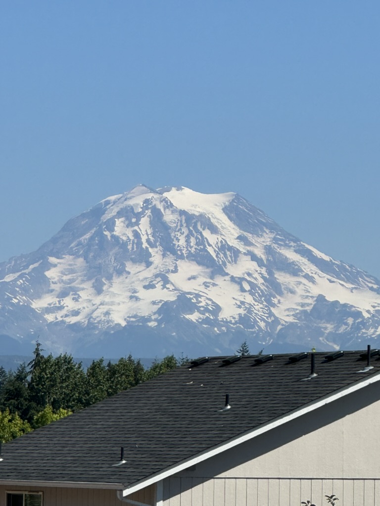 Mt. Rainier seen over rooftops from Tacoma