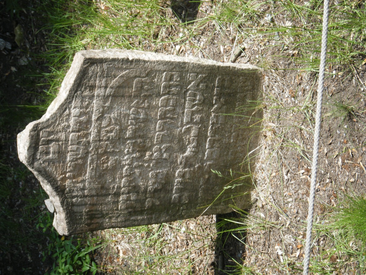 Close-up of ancient weathered Hebrew gravestone in the Old Jewish Cemetery, Prague