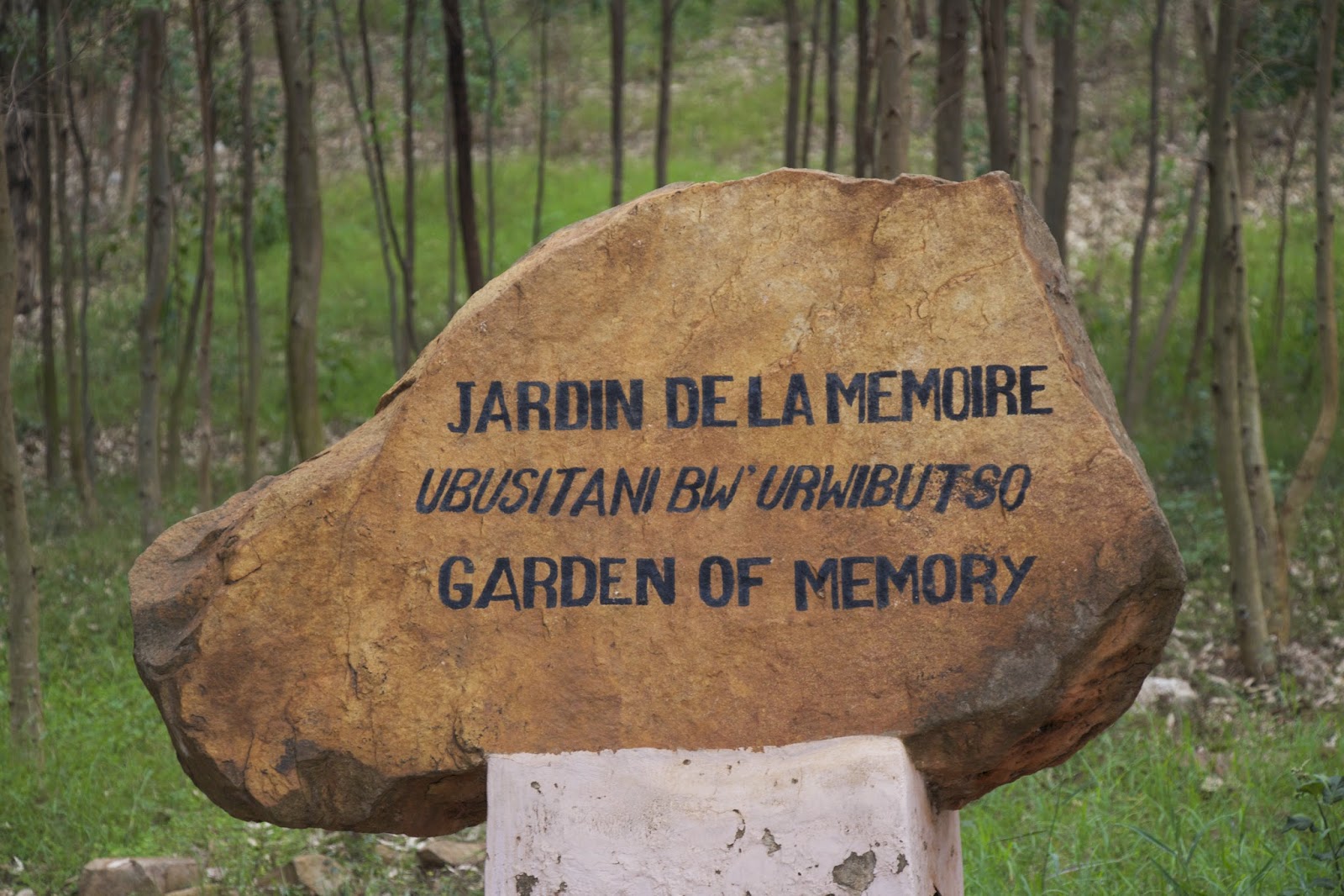 Stone marker reading Jardin de la Memoire, Garden of Memory at the genocide memorial