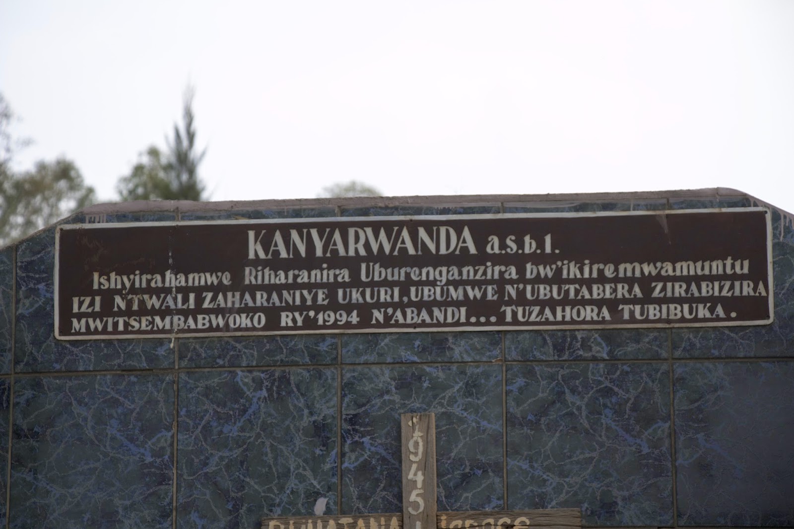 Close-up of the Kanyarwanda memorial inscription referencing the 1994 genocide