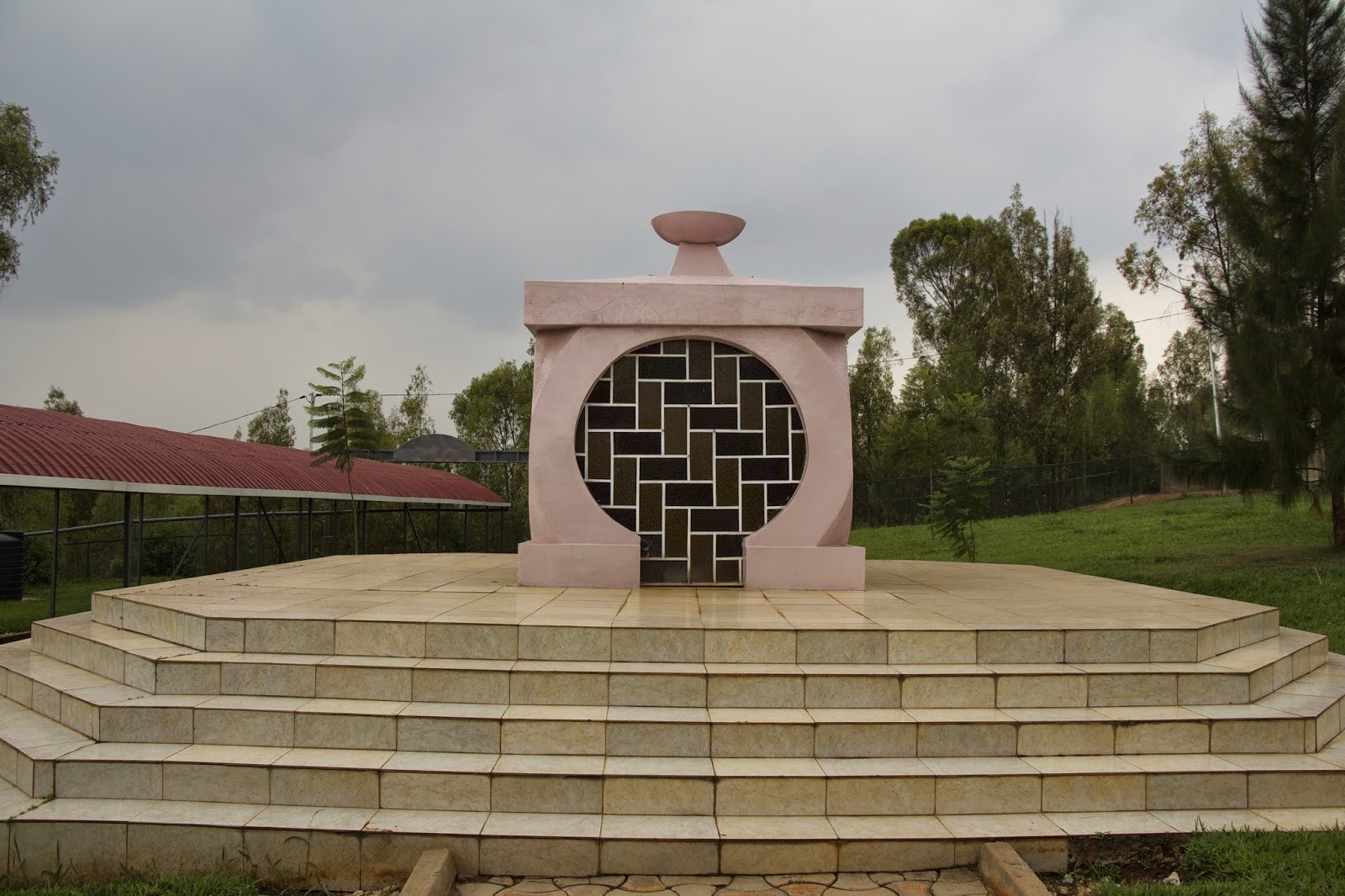 Pink memorial monument at a genocide remembrance site