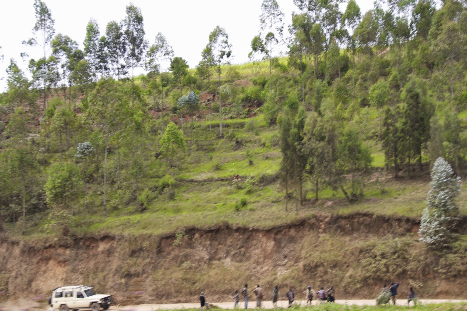 Second vehicle with locals staring from the roadside