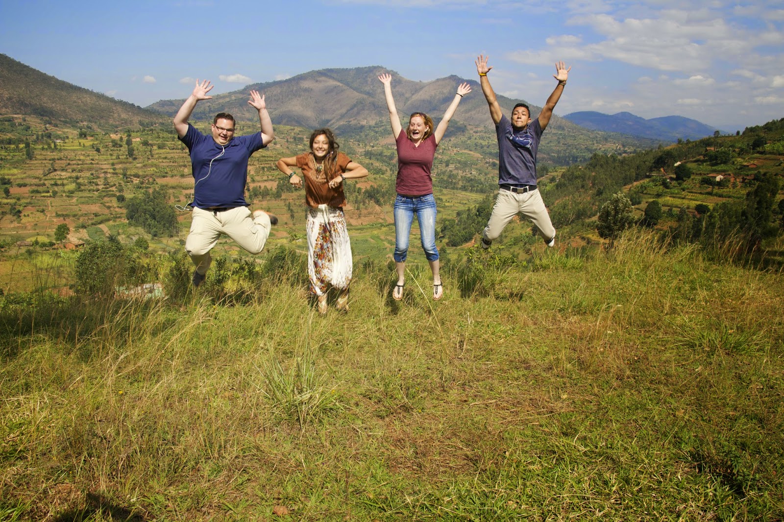 Group jumping for joy on a Rwandan hillside