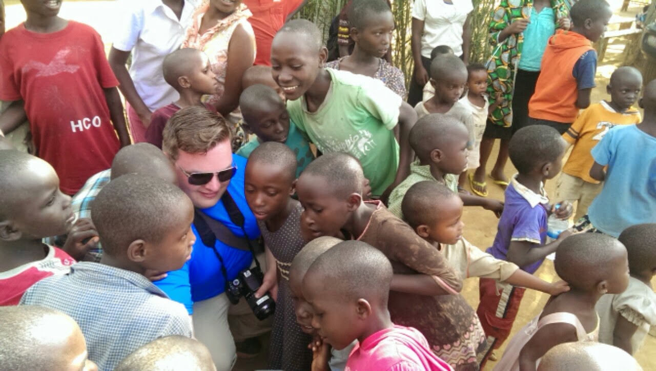 Aerial view of the selfie crowd with dozens of children surrounding the camera