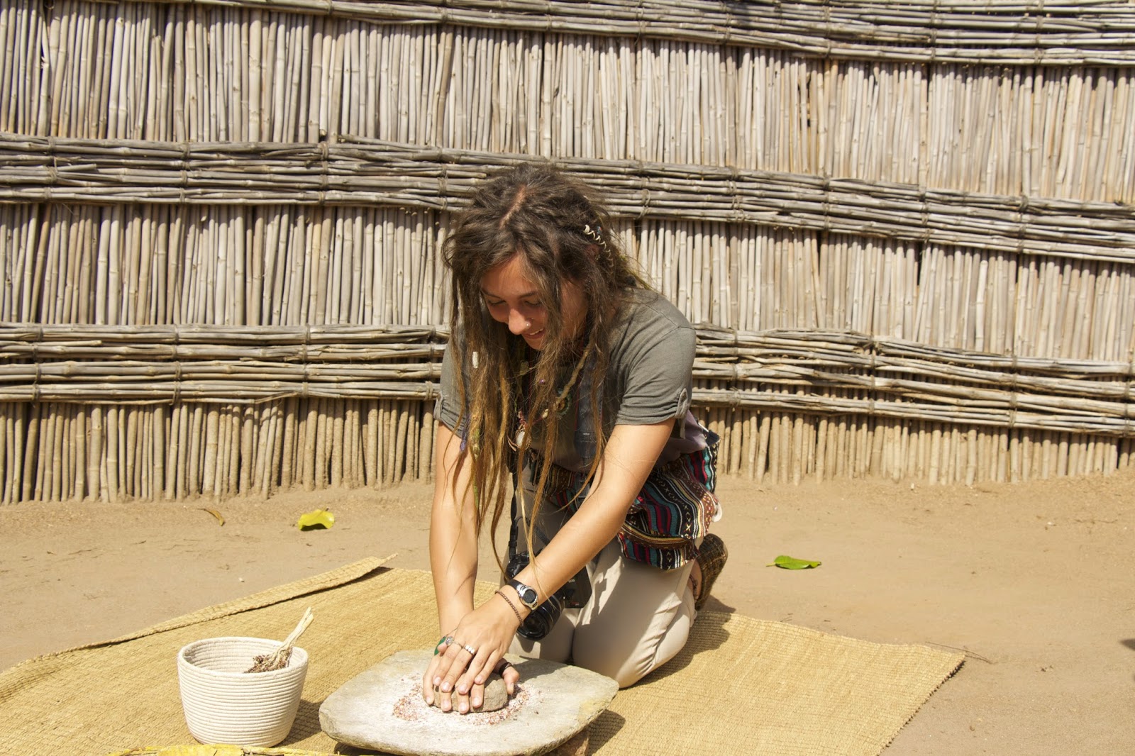 Grinding sorghum to make beer