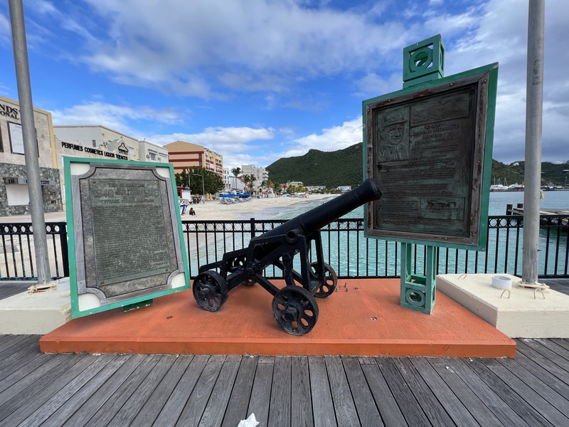 Historic cannon and plaques on the Philipsburg boardwalk overlooking Great Bay
