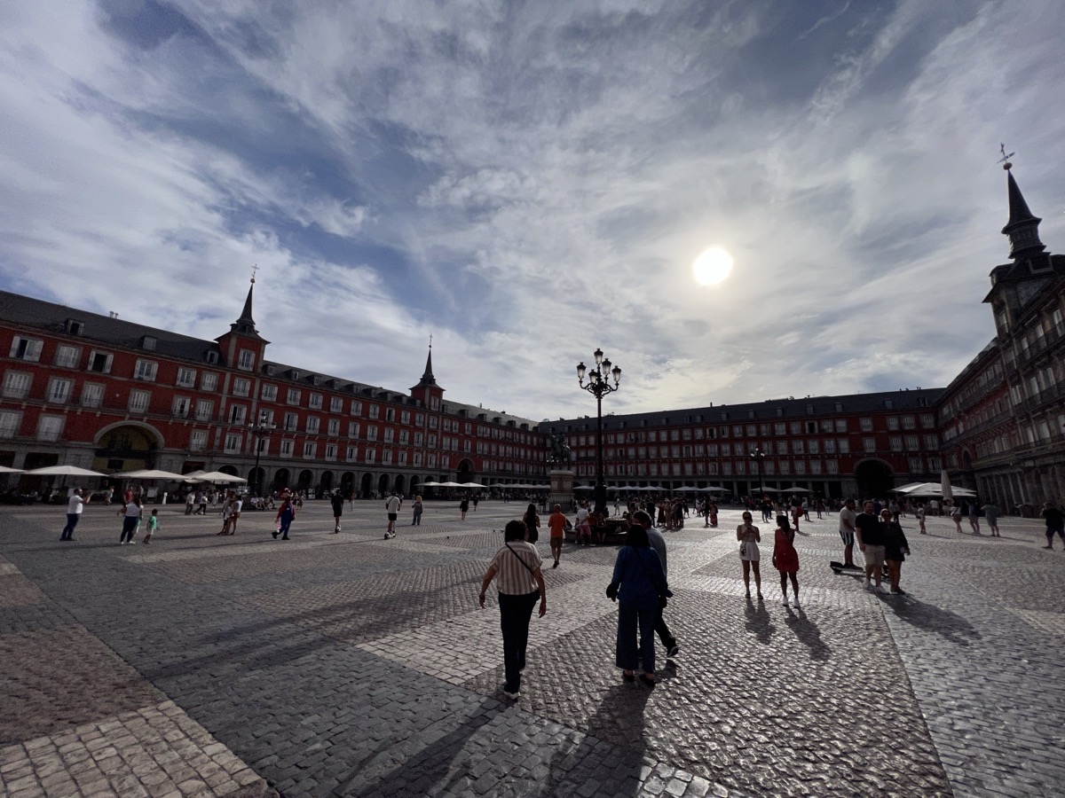 Plaza Mayor in Madrid with historic buildings and crowded outdoor cafes
