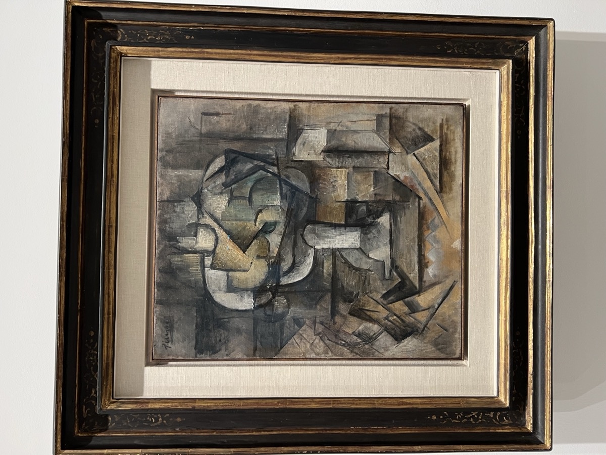 Cubist still life painting in muted grey and brown tones at the Reina Sofía