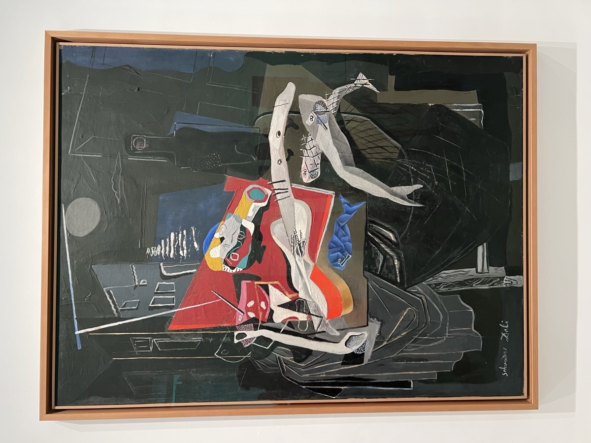 Large surrealist painting by Salvador Dalí with distorted white figure against dark background