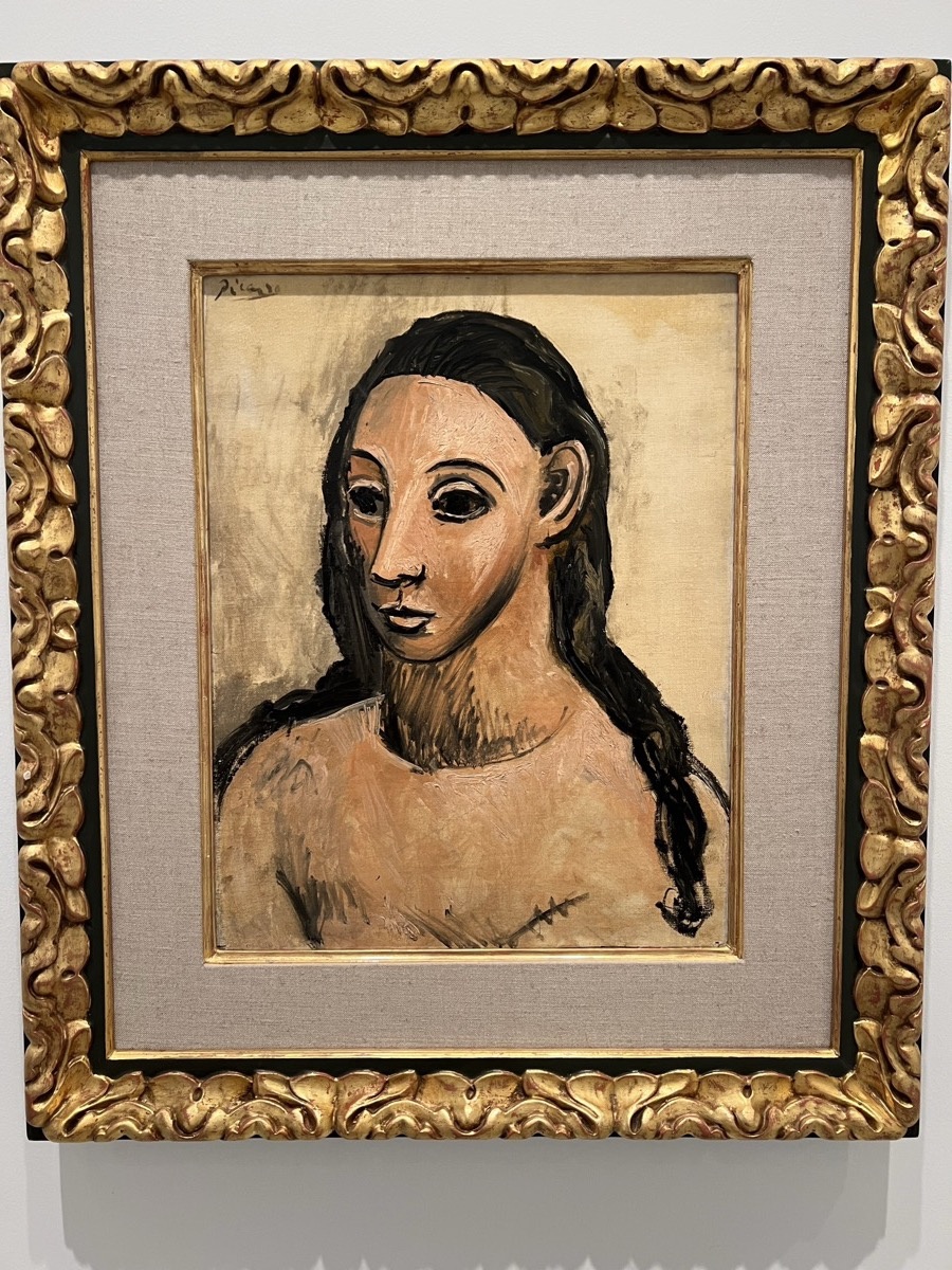 Portrait painting of a woman in ornate gold frame at Reina Sofía