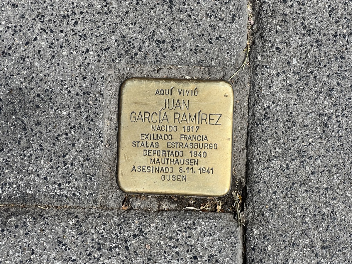 Stolperstein brass memorial stone embedded in a Madrid sidewalk